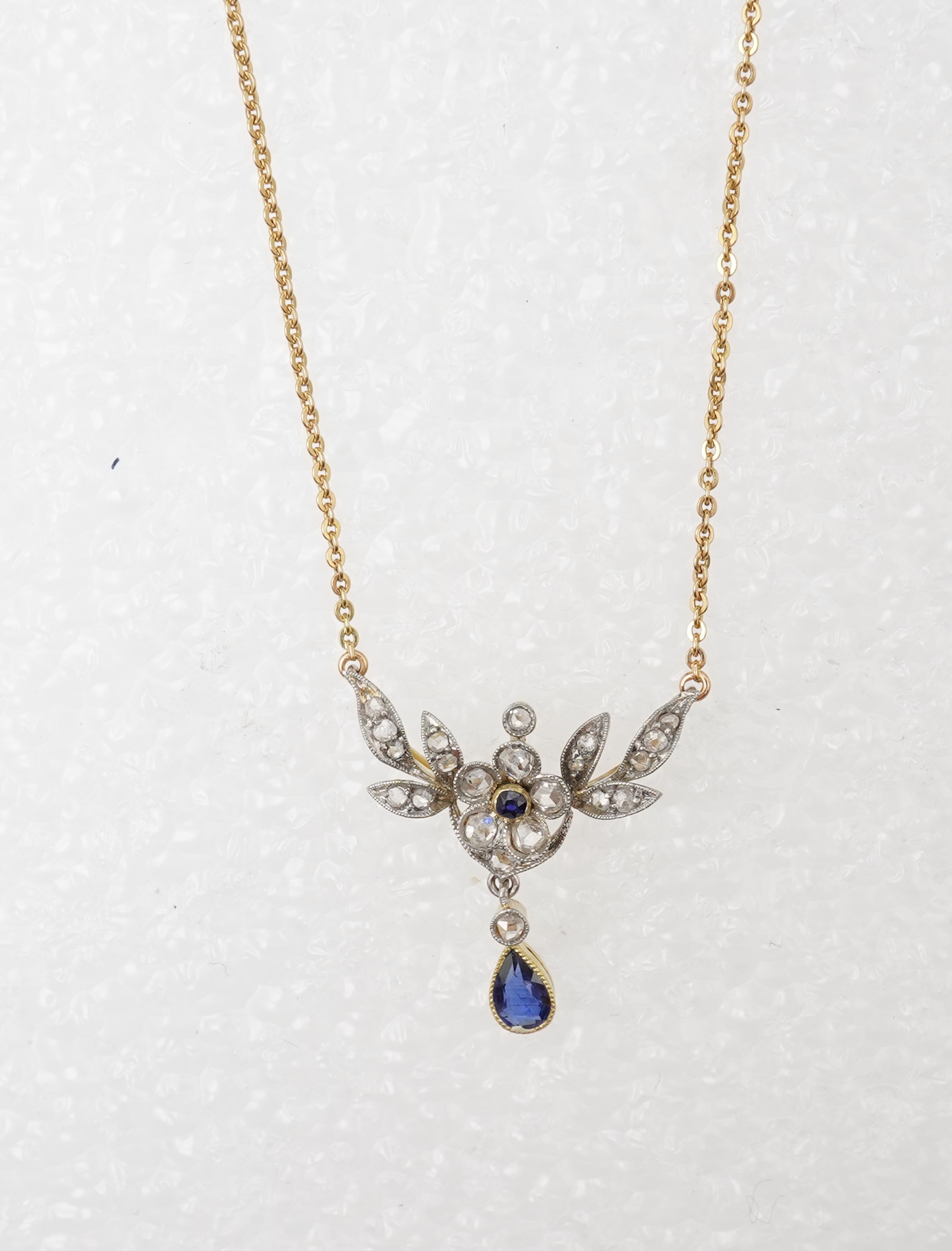 A sapphire and diamond pendant